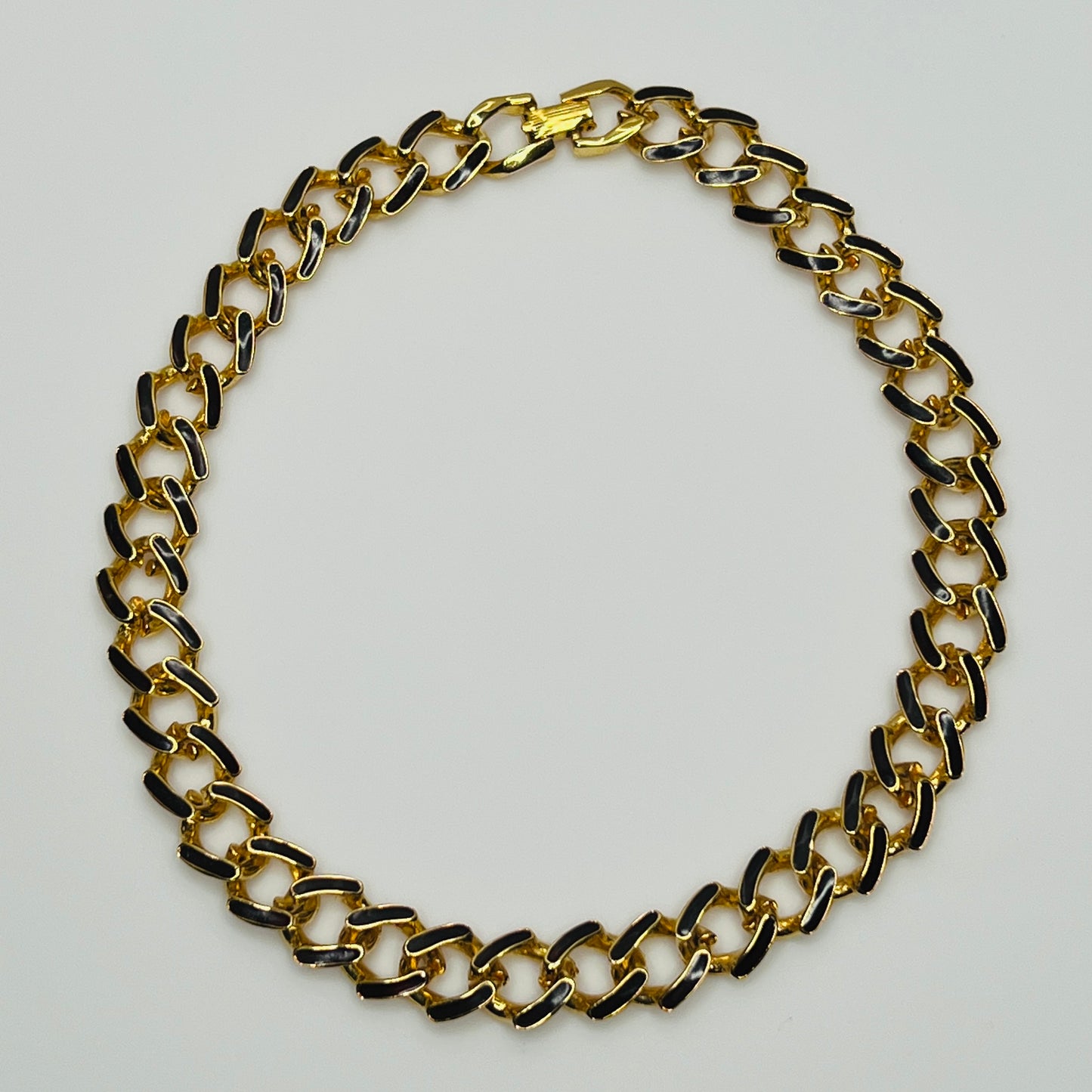 1980s gold-tone chain necklace with brown enamel links and hinge clasp, collar length.