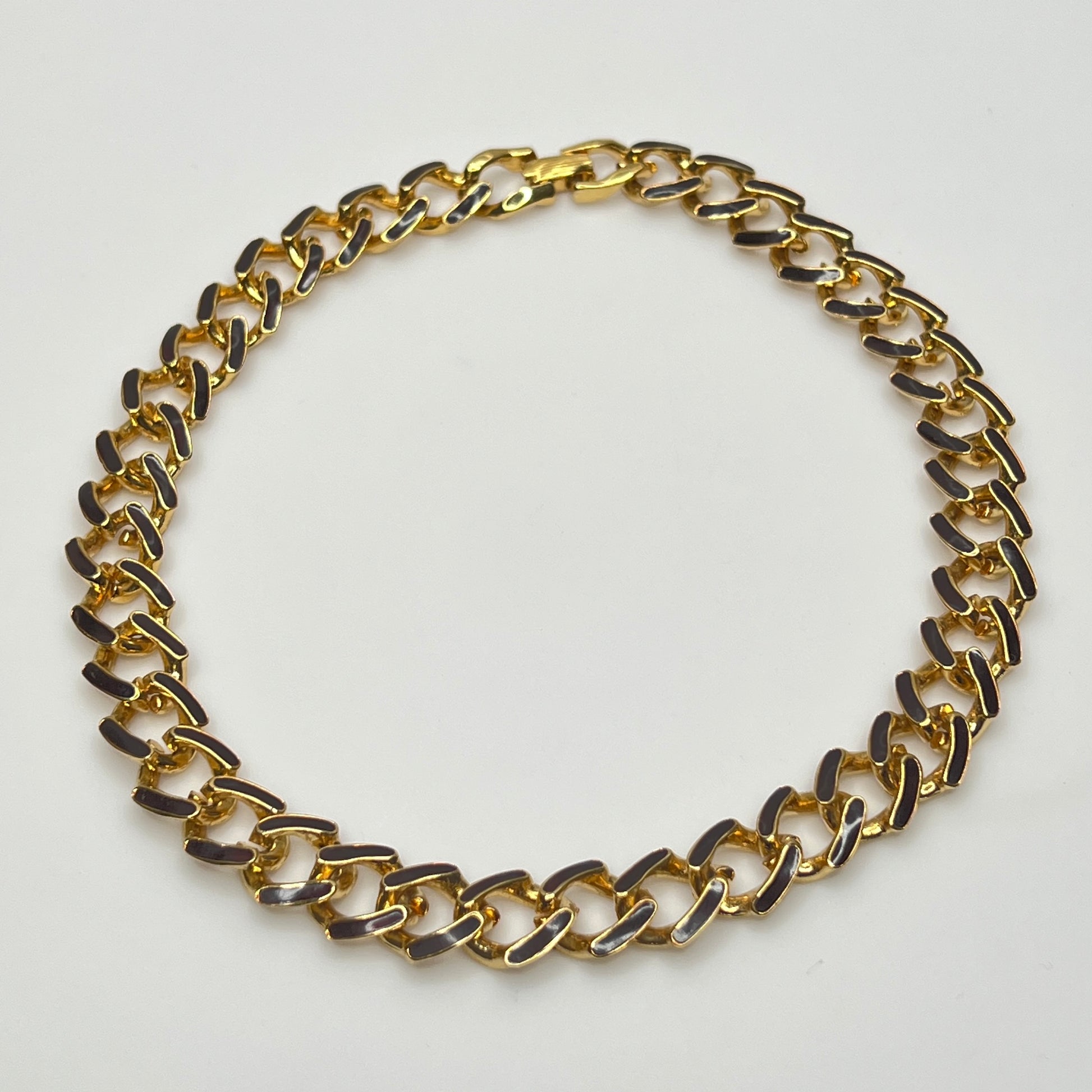 Gold chain necklace on a white background