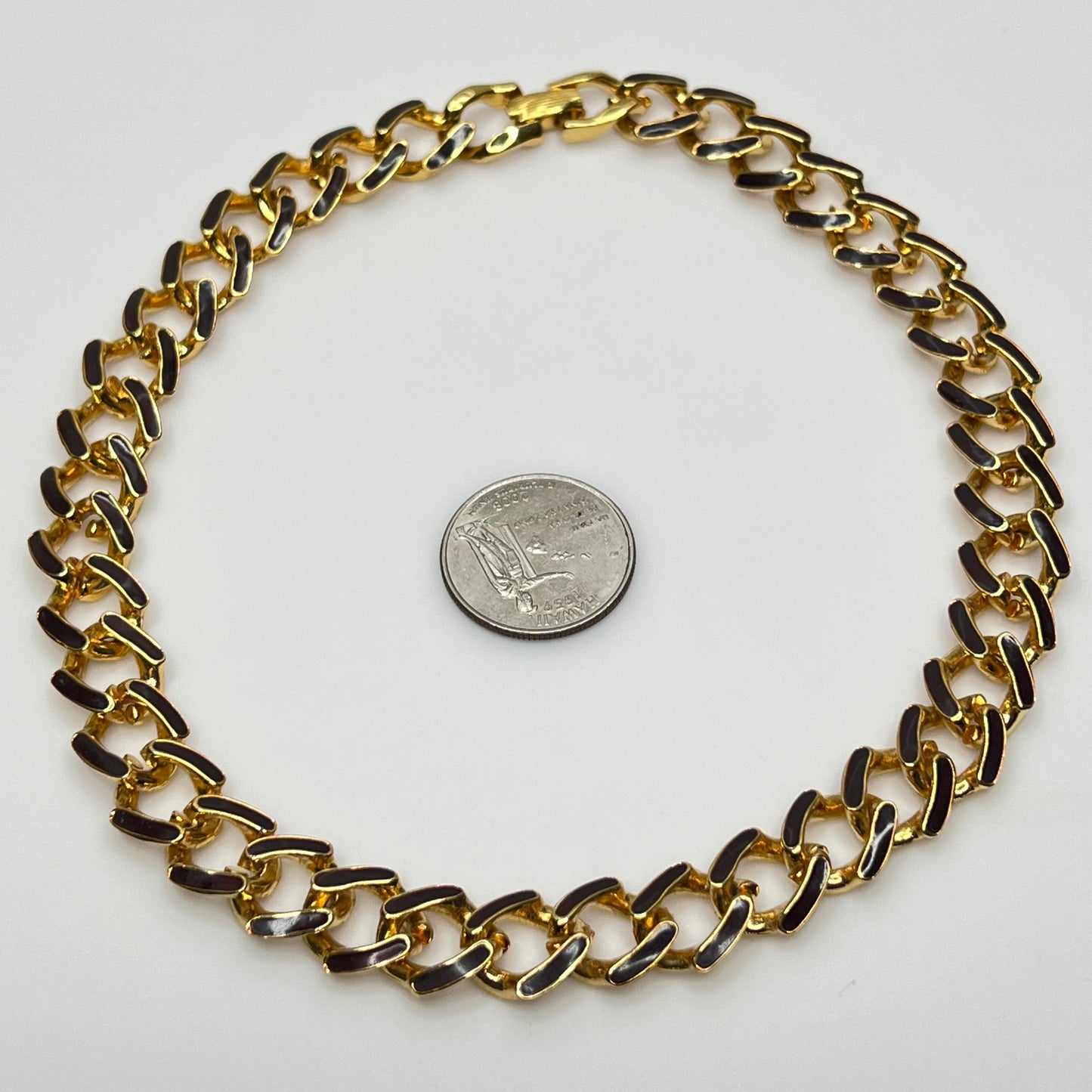 1980s gold-tone chain necklace with brown enamel links and hinge clasp, collar length.