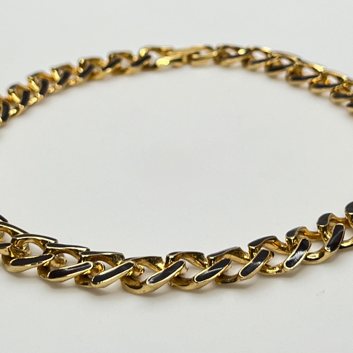 1980s gold-tone chain necklace with brown enamel links and hinge clasp, collar length.