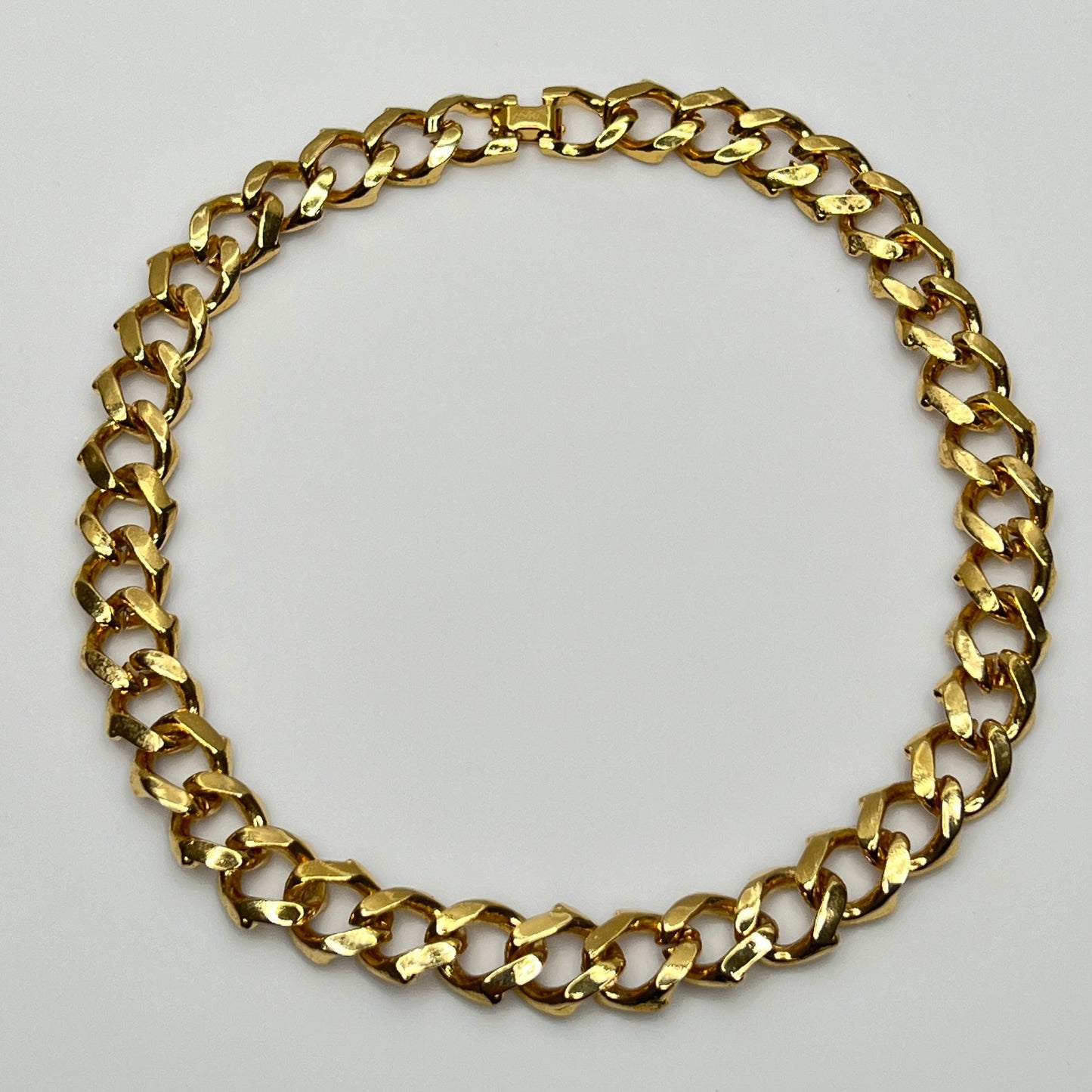 1980s gold-tone chain necklace with brown enamel links and hinge clasp, collar length.