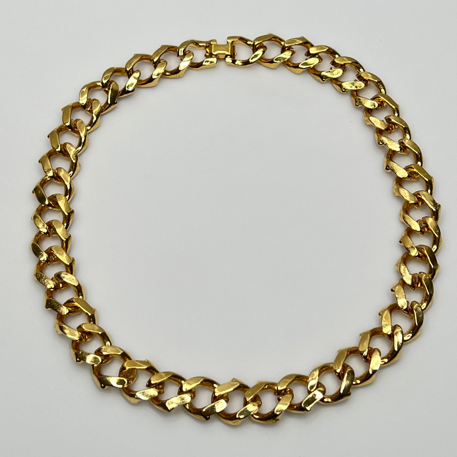 1980s gold-tone chain necklace with brown enamel links and hinge clasp, collar length.