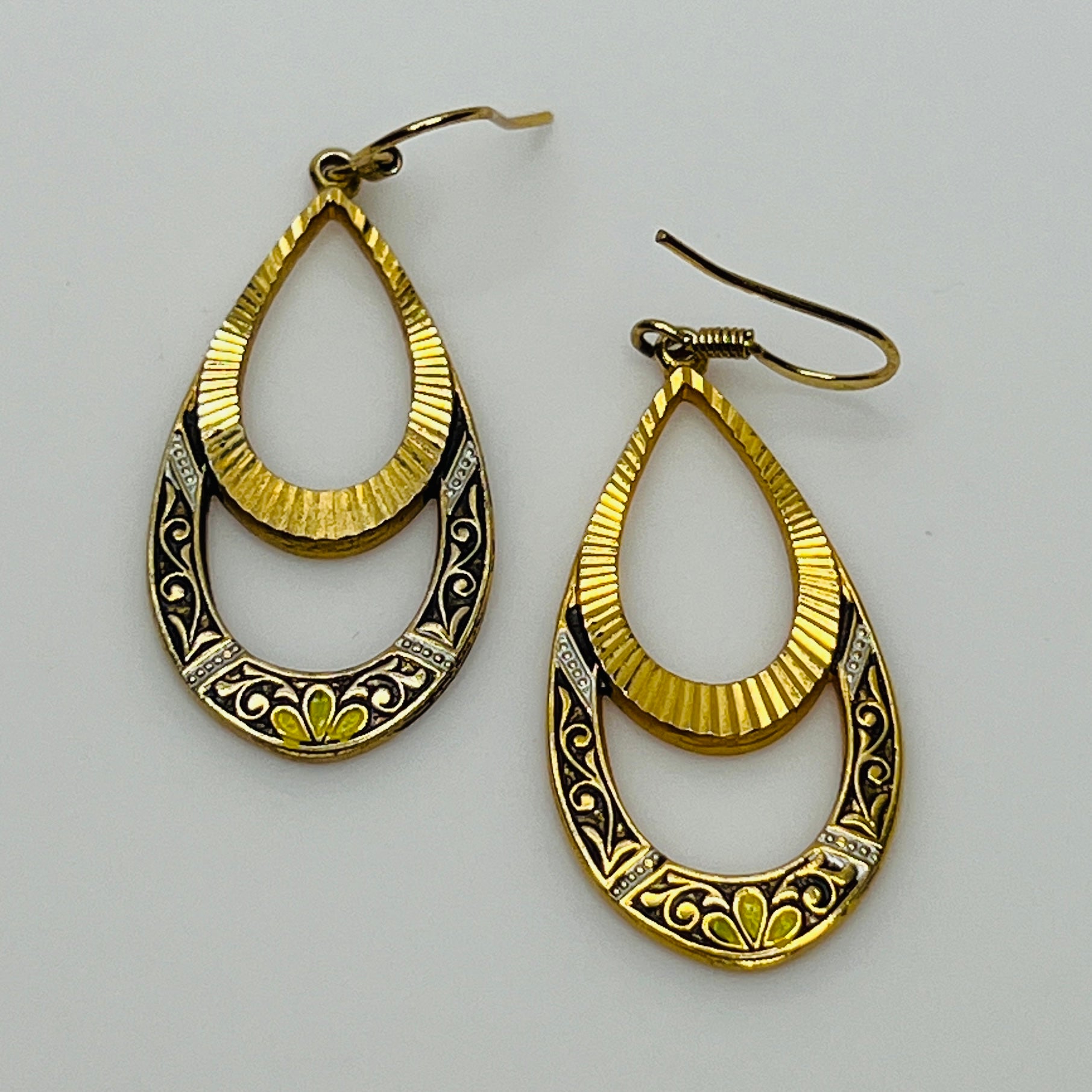 Gold teardrop dangle earrings with enamel scroll and floral design