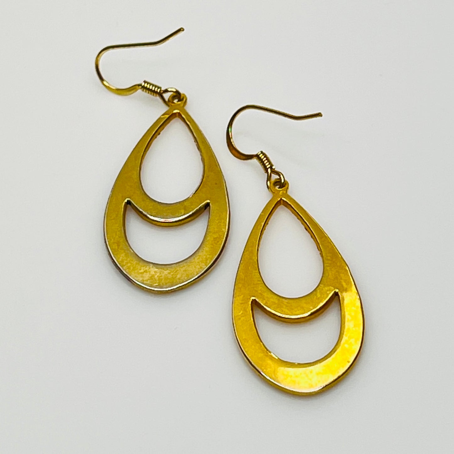 Vintage gold-tone statement earrings with floral accents