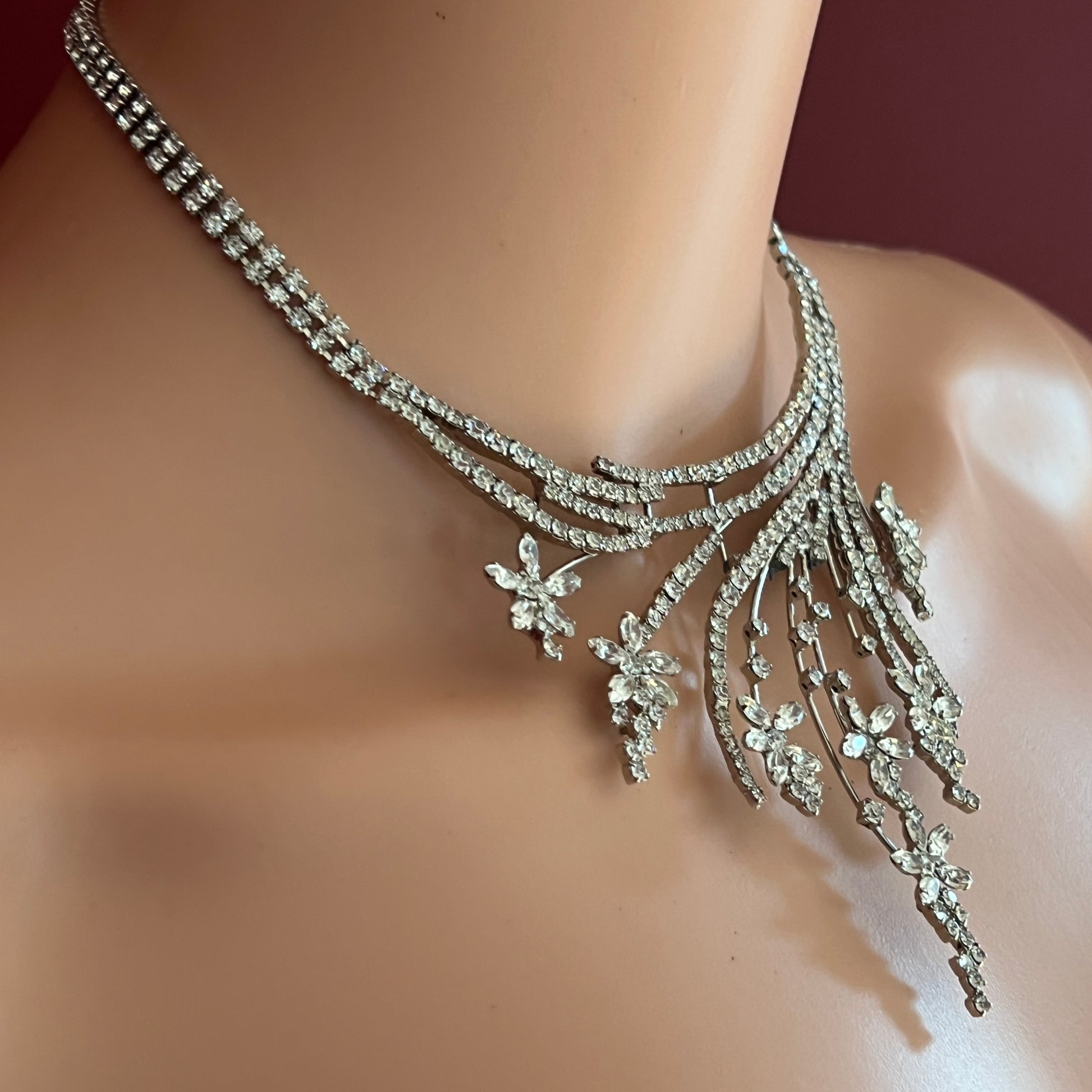 Vintage clear rhinestone bib necklace with cascading floral spray design