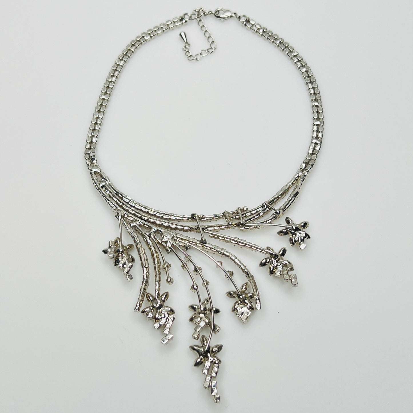 Mid-century floral rhinestone necklace in silvertone with prong-set stones