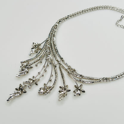 Mid-century floral rhinestone necklace in silvertone with prong-set stones