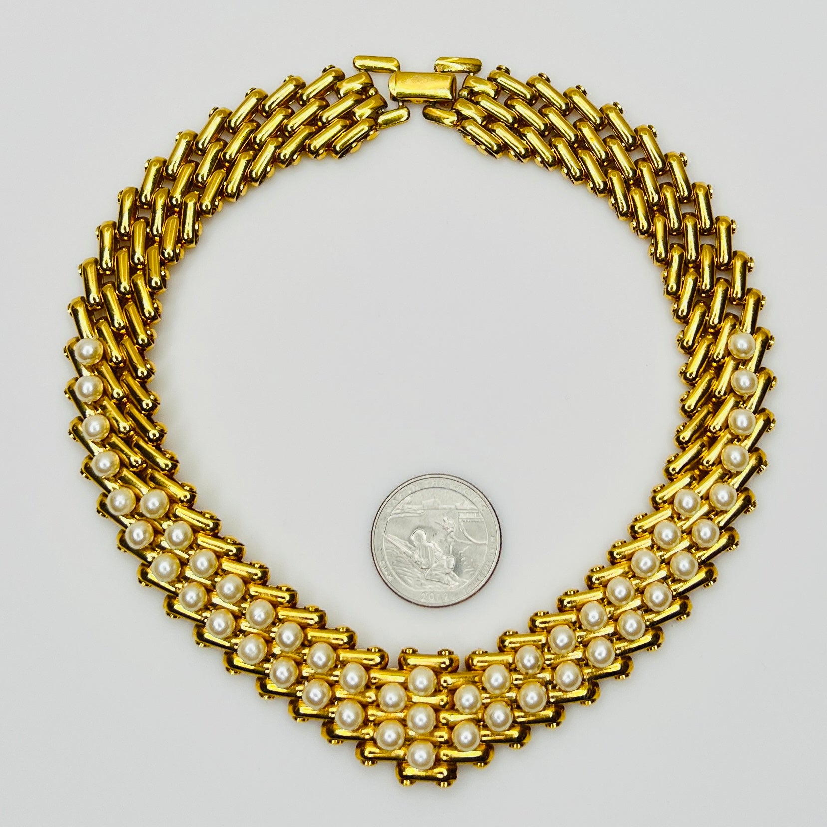 V-shaped gold-tone choker necklace with faux pearls in stacked link design