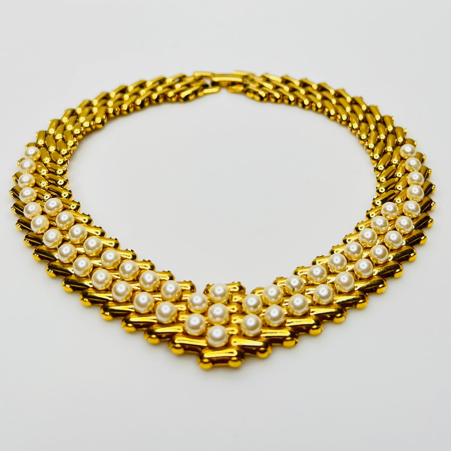 V-shaped gold-tone choker necklace with faux pearls in stacked link design