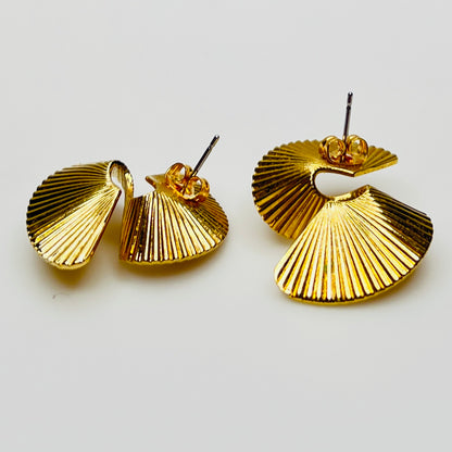 Gold tone sculptural swirl pierced stud earrings