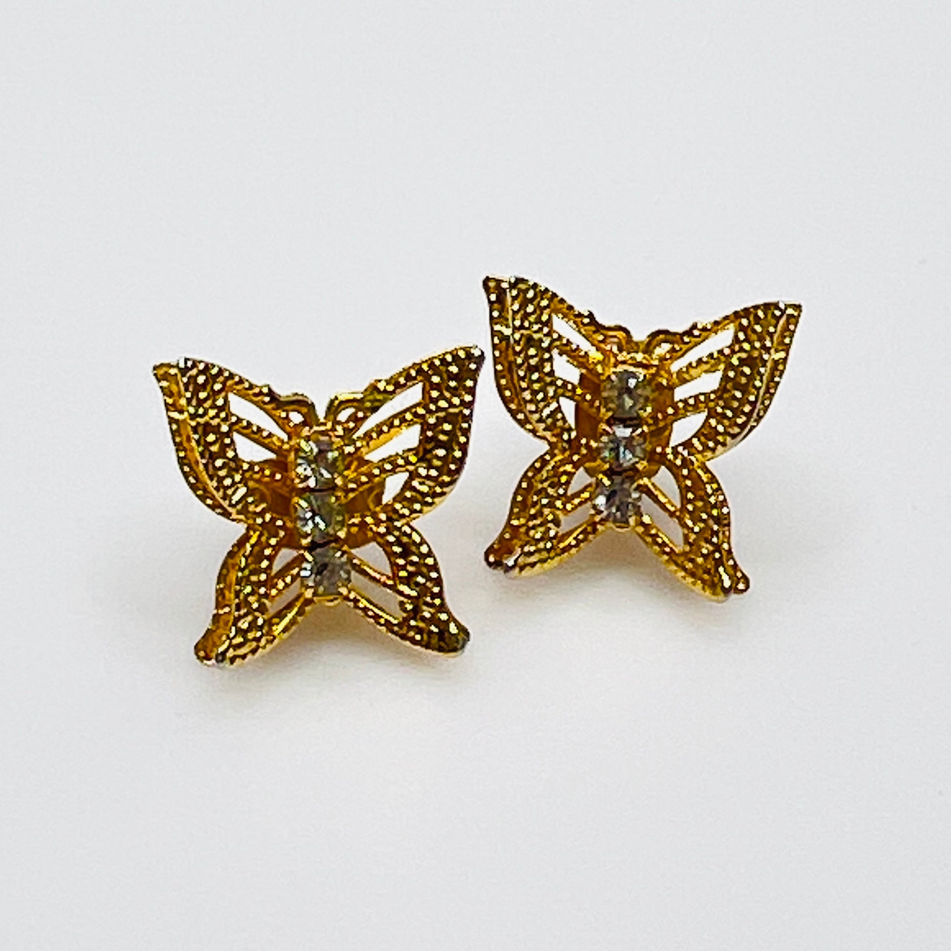 Vintage gold filigree butterfly stud earrings with rhinestone accents