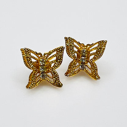 Vintage gold filigree butterfly stud earrings with rhinestone accents