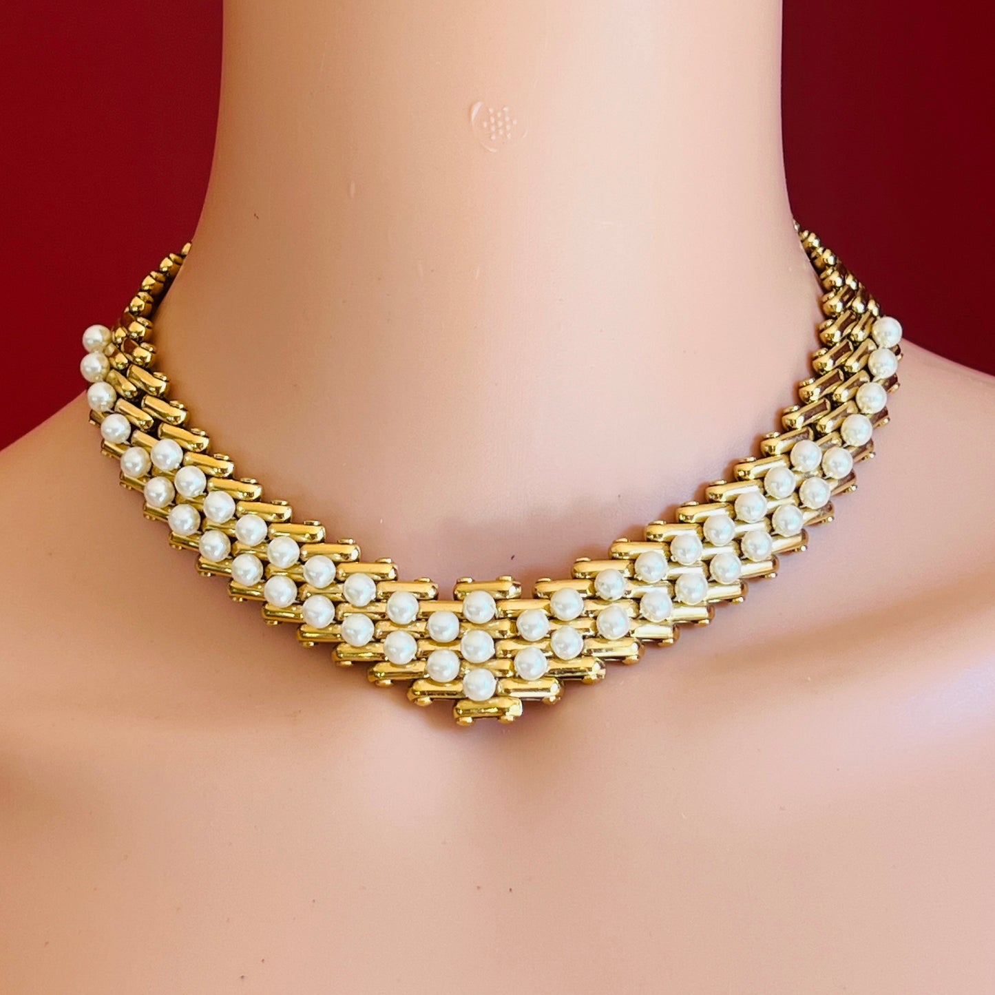 V-shaped gold-tone choker necklace with faux pearls in stacked link design