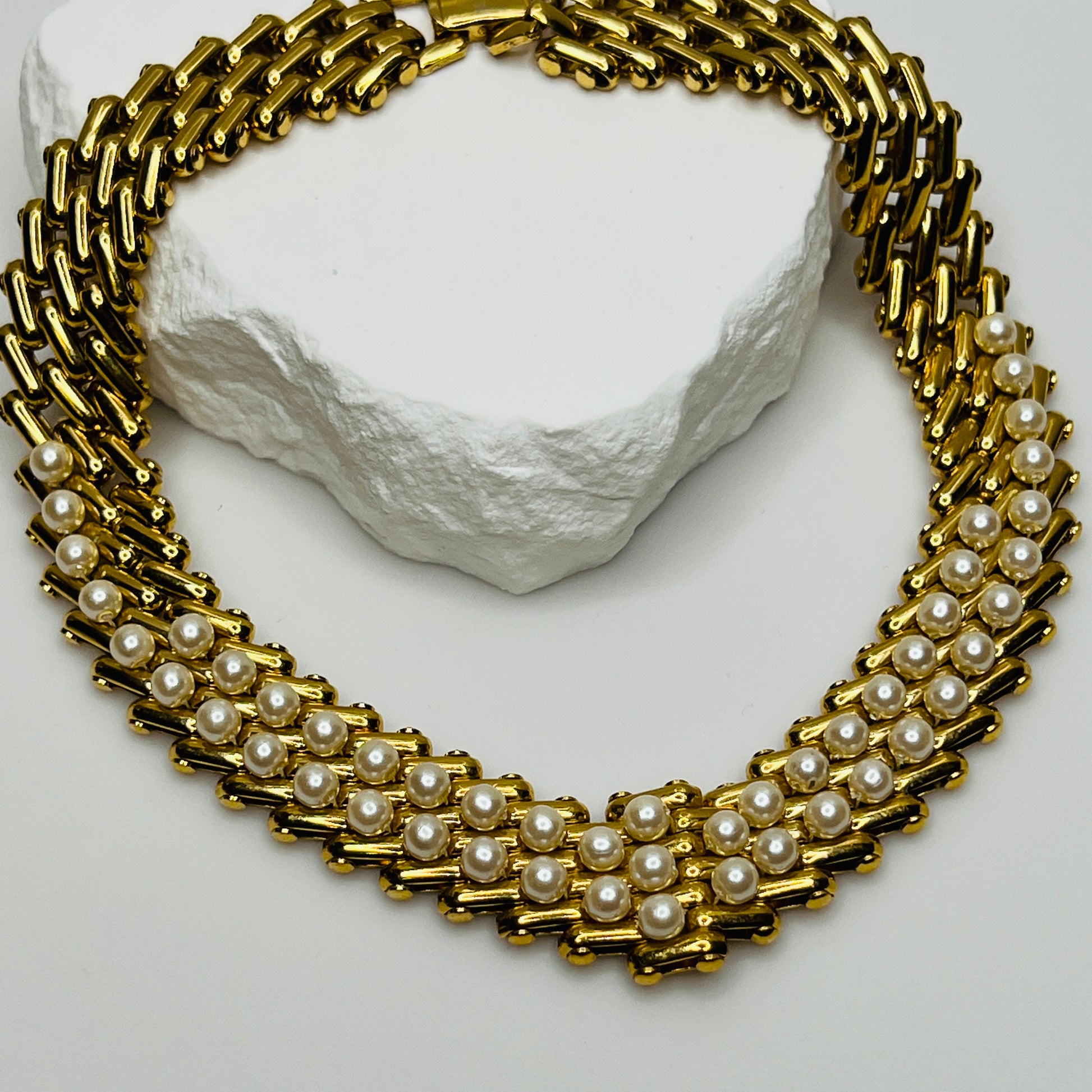 V-shaped gold-tone choker necklace with faux pearls in stacked link design