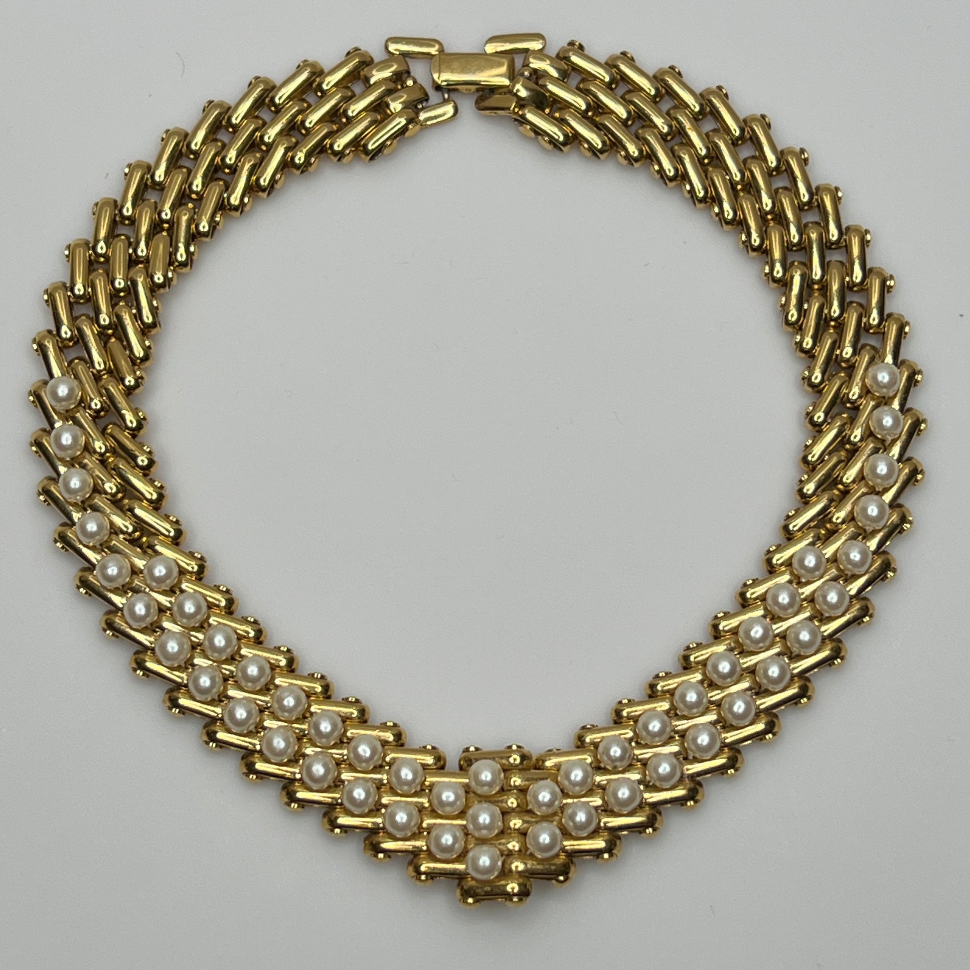 V-shaped gold-tone choker necklace with faux pearls in stacked link design