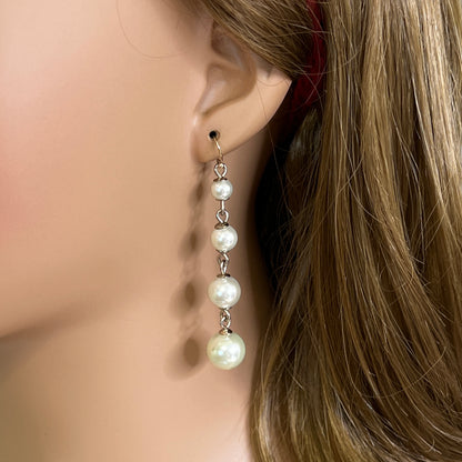 Vintage Lulu Frost long dangle earrings with graduated faux pearls on gold-tone wires