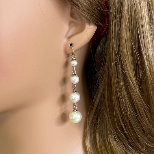 Vintage Lulu Frost long dangle earrings with graduated faux pearls on gold-tone wires