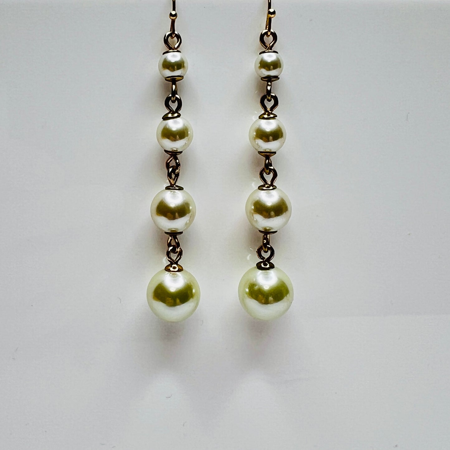 Vintage Lulu Frost long dangle earrings with graduated faux pearls on gold-tone wires