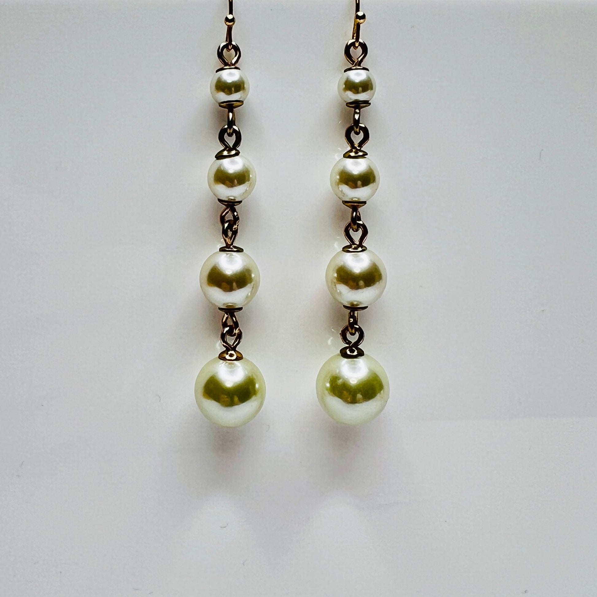 Vintage Lulu Frost long dangle earrings with graduated faux pearls on gold-tone wires