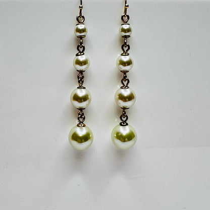 Vintage Lulu Frost long dangle earrings with graduated faux pearls on gold-tone wires