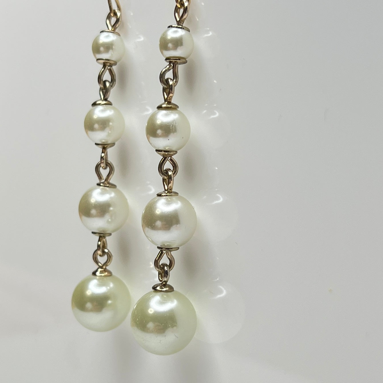 Vintage Lulu Frost long dangle earrings with graduated faux pearls on gold-tone wires