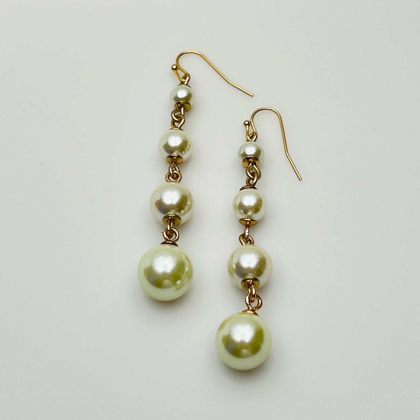 Vintage Lulu Frost long dangle earrings with graduated faux pearls on gold-tone wires