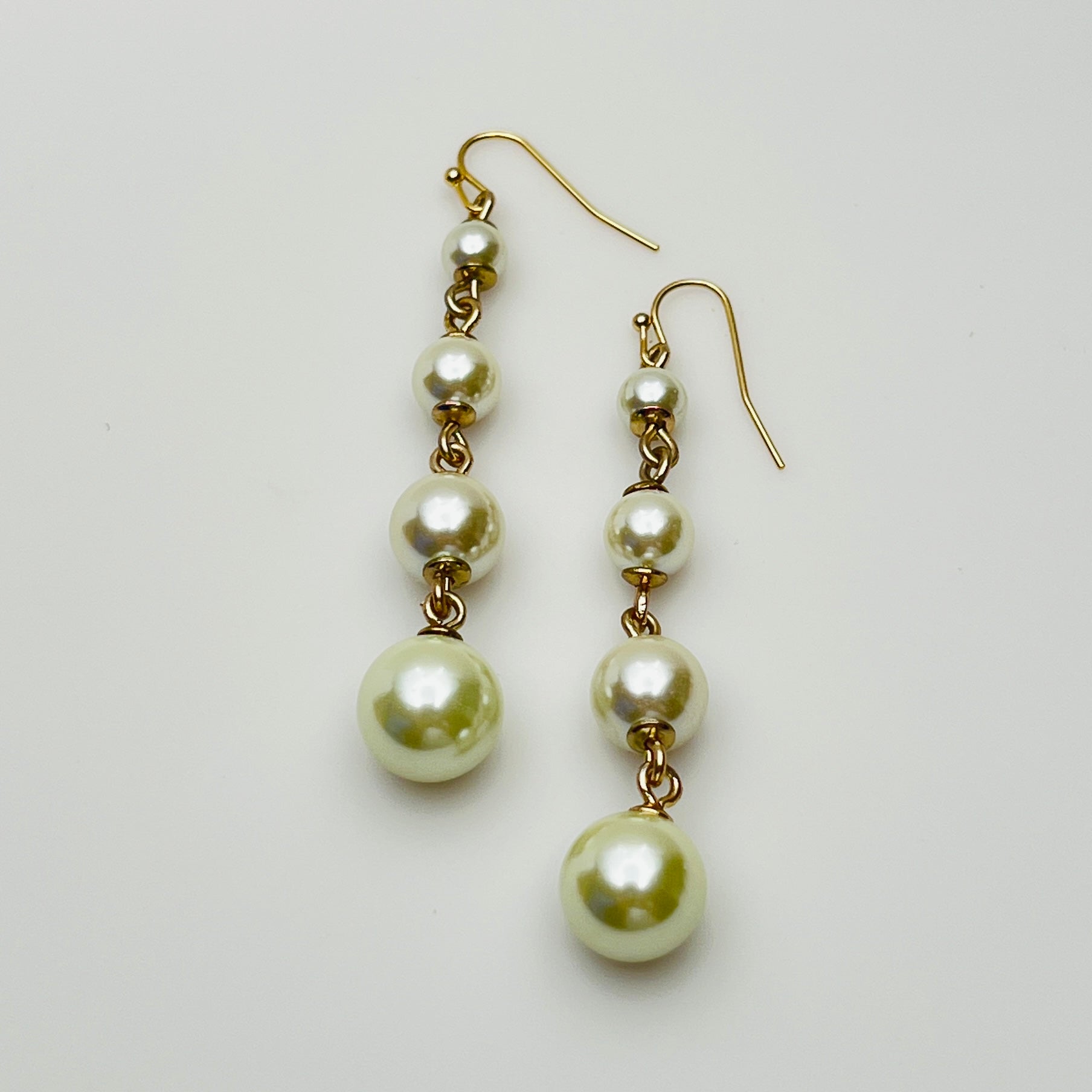 Vintage Lulu Frost long dangle earrings with graduated faux pearls on gold-tone wires