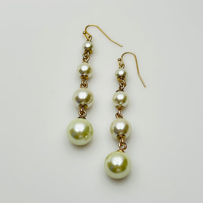 Vintage Lulu Frost long dangle earrings with graduated faux pearls on gold-tone wires