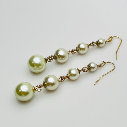 Vintage Lulu Frost long dangle earrings with graduated faux pearls on gold-tone wires