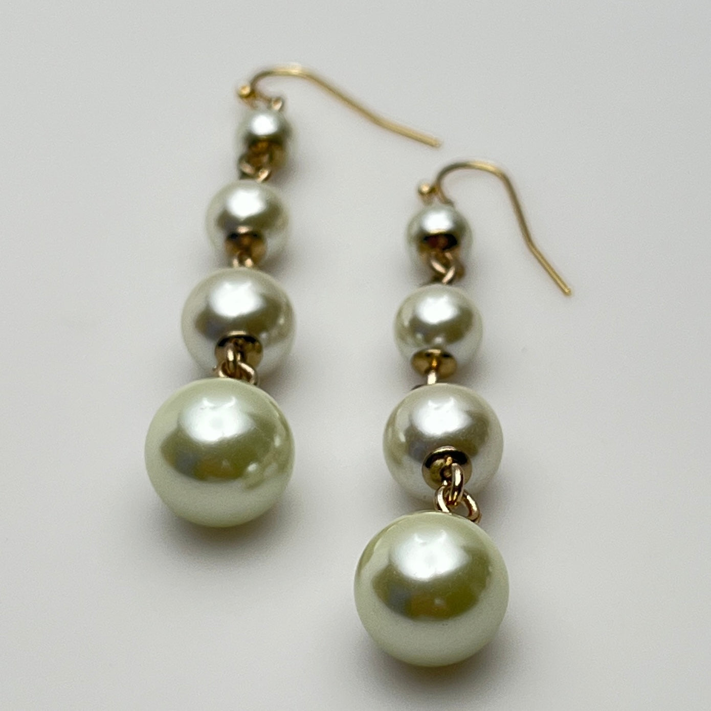 Vintage Lulu Frost long dangle earrings with graduated faux pearls on gold-tone wires