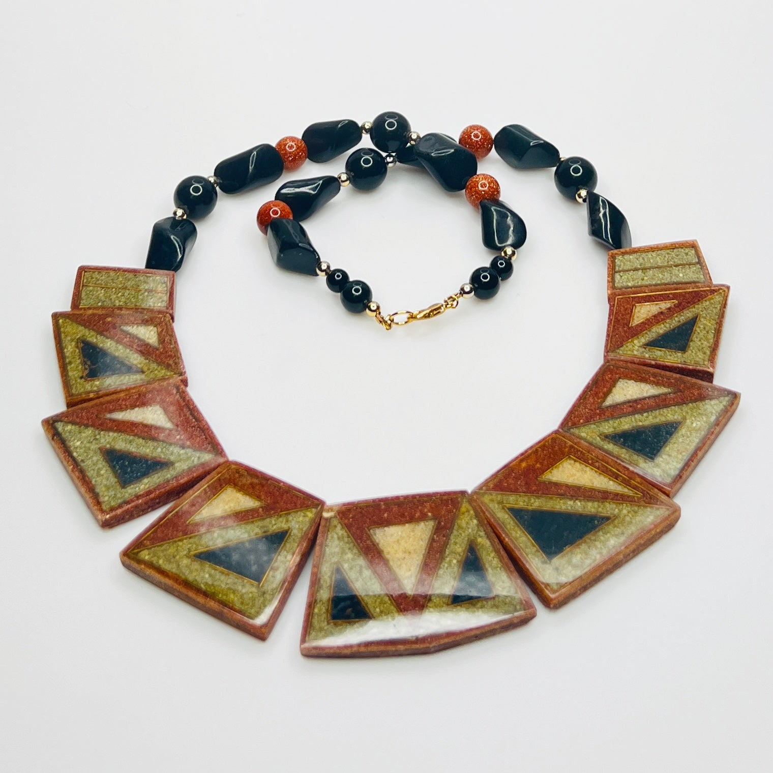 Front view of reversible terracotta and olive tile necklace