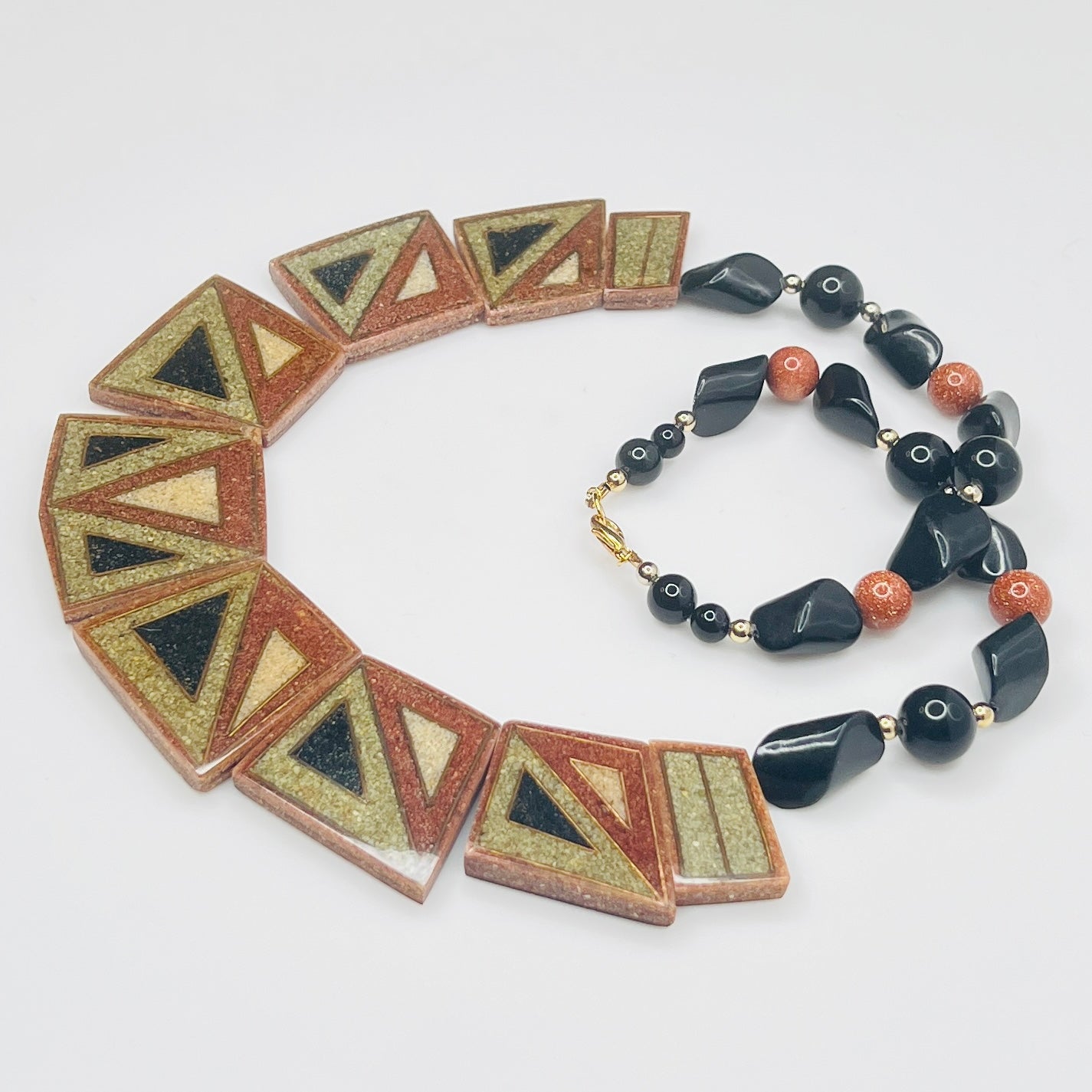 Front view of reversible terracotta and olive tile necklace