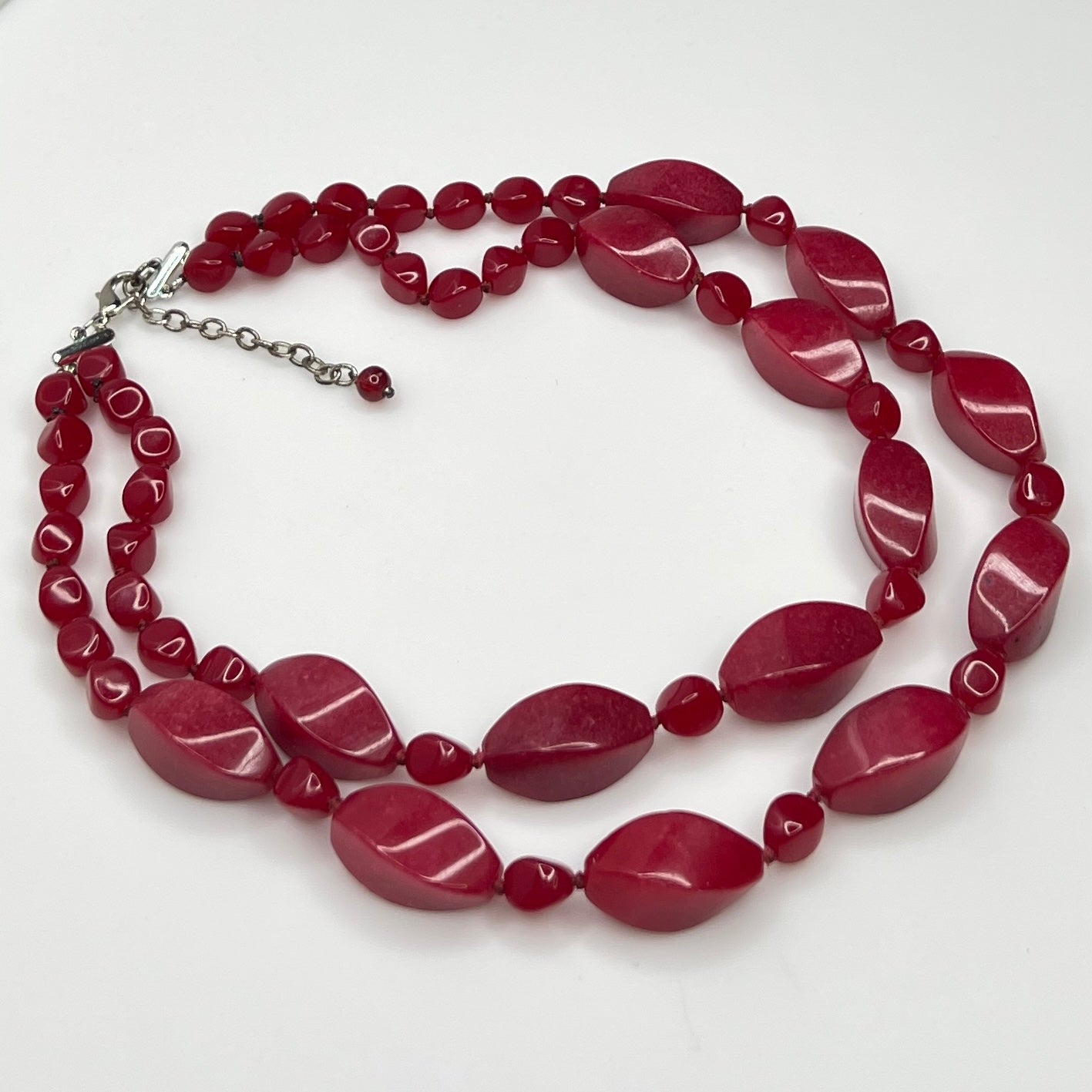 Double strand red bead necklace with large glass ovals and smaller lucite rounds with silver-tone clasp