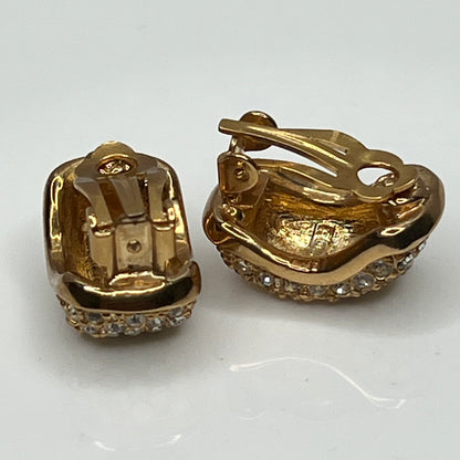 Gold rhinestone clip-on earrings signed Roman with pave setting