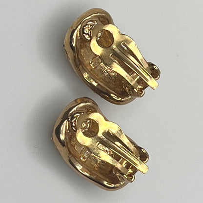 Gold rhinestone clip-on earrings signed Roman with pave setting