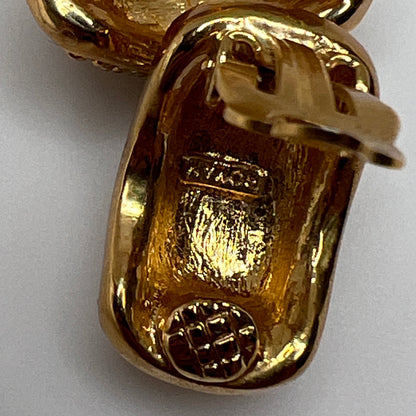 Gold rhinestone clip-on earrings signed Roman with pave setting