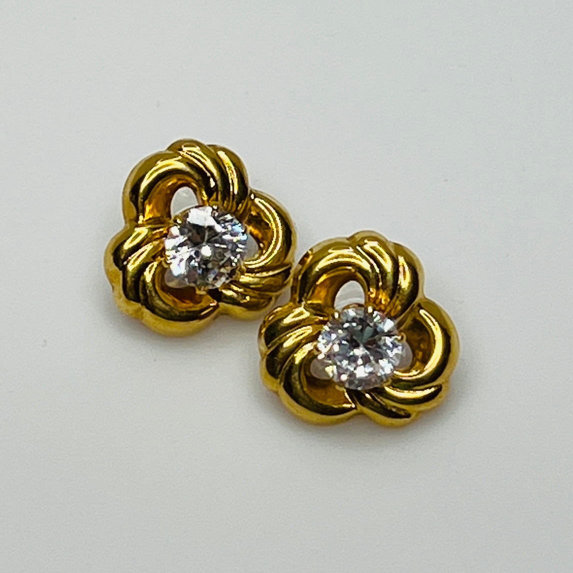 Convertible gold swirl earrings with clear crystal studs, 1980s