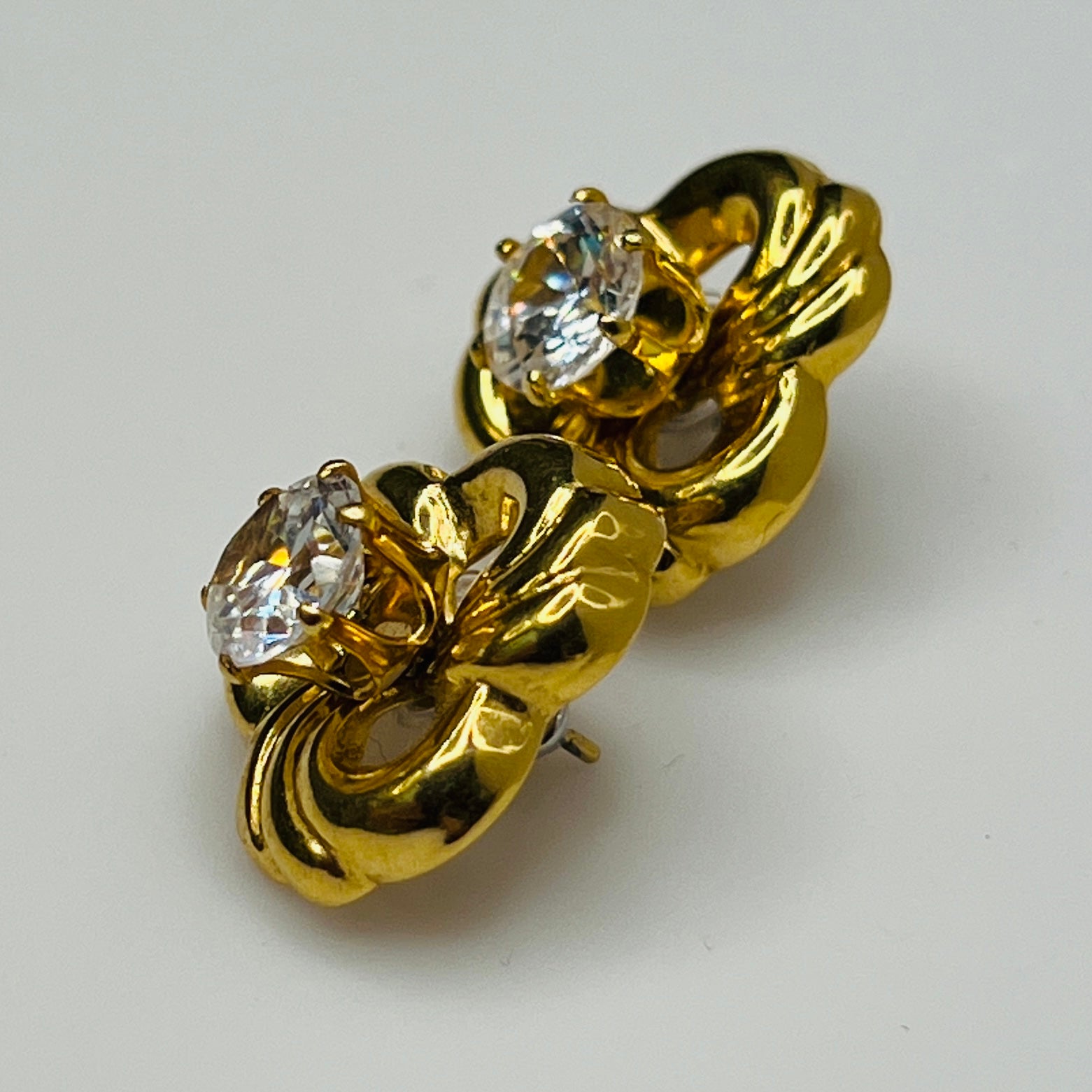 Convertible gold swirl earrings with clear crystal studs, 1980s