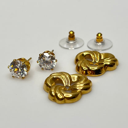Crystal stud earrings with removable gold-tone swirl jackets