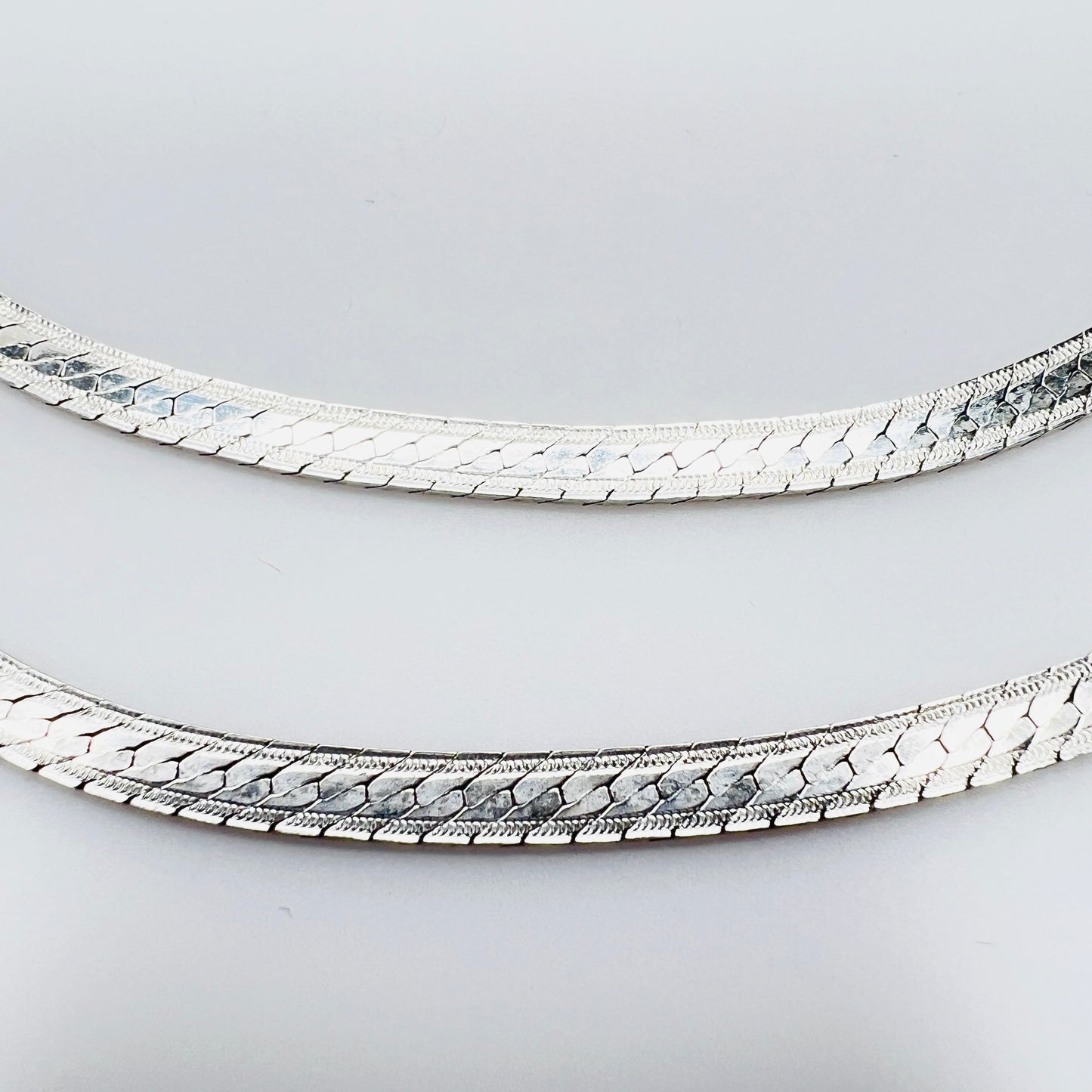 Detail of textured sterling silver snake chain links