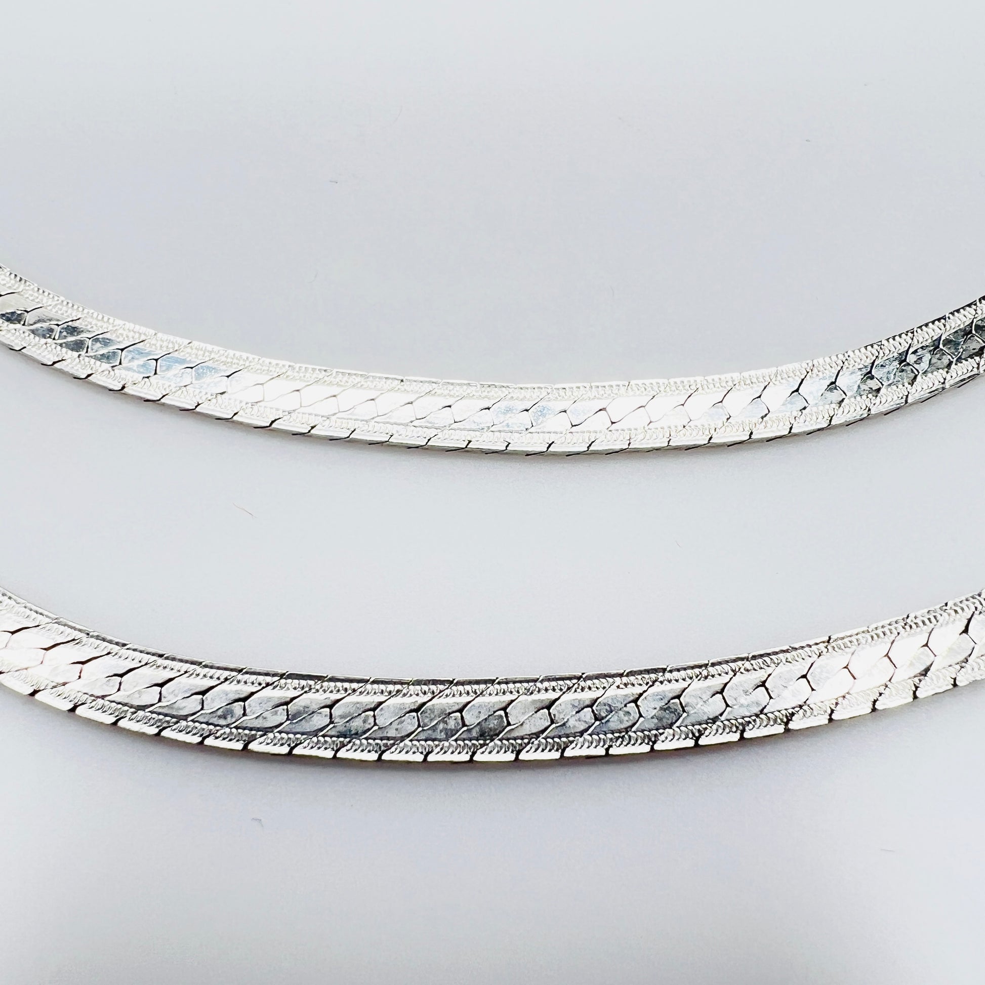 Detail of textured sterling silver snake chain links