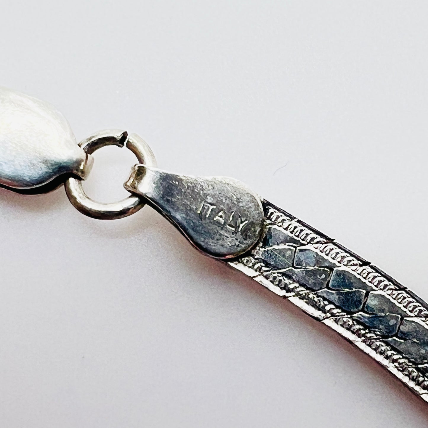 Close up of sterling 925 Italy clasp on vintage snake chain