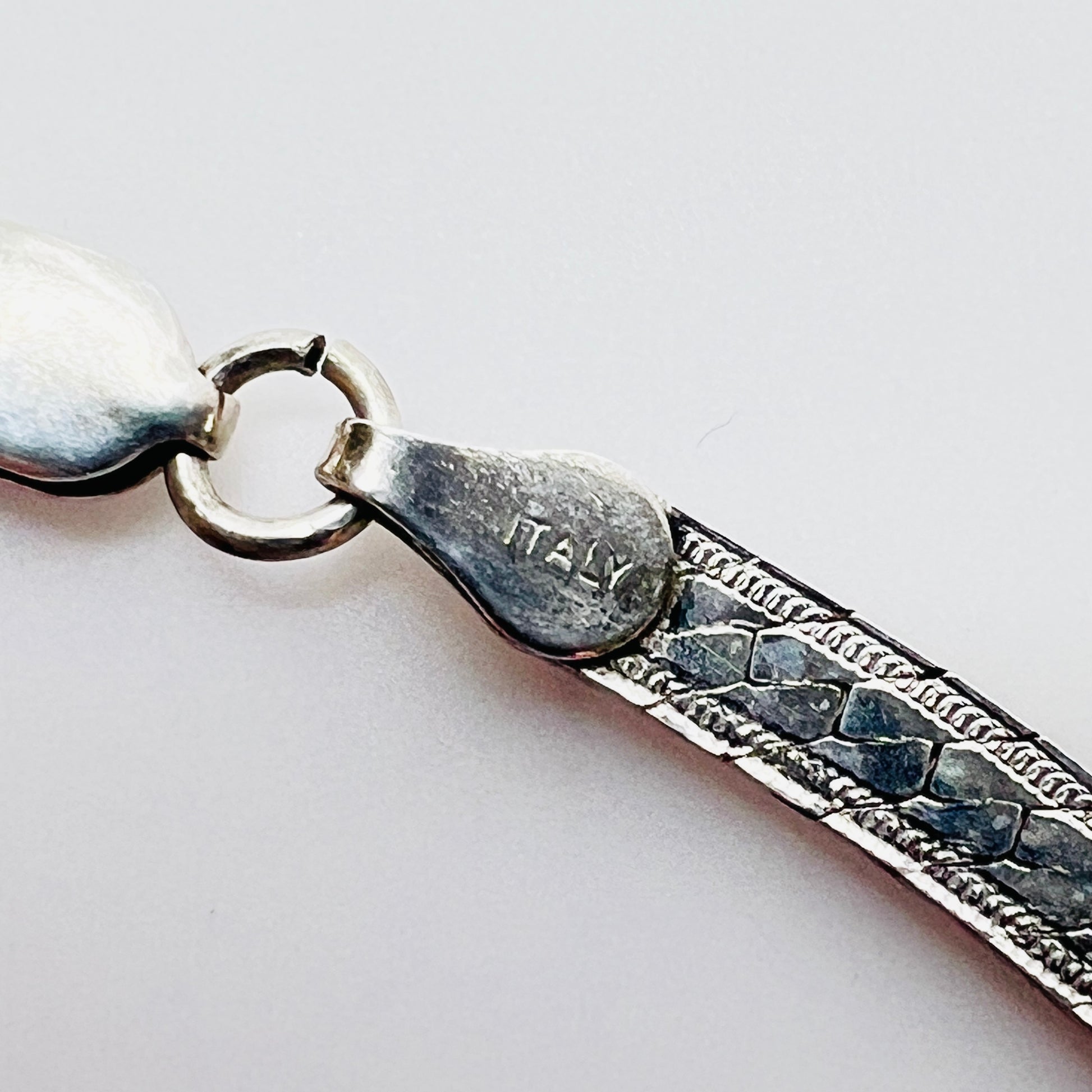 Close up of sterling 925 Italy clasp on vintage snake chain