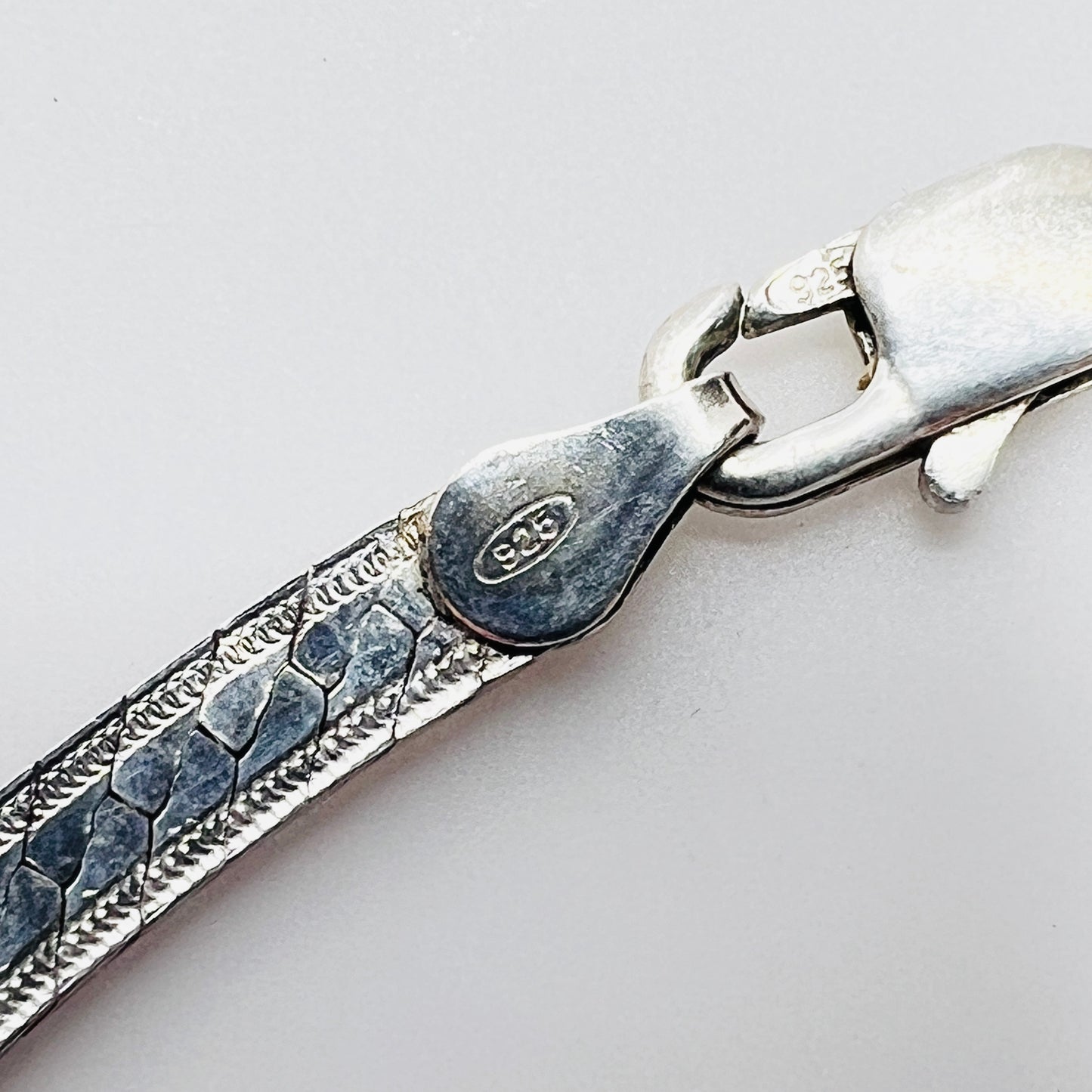 Close up of sterling 925 Italy clasp on vintage snake chain