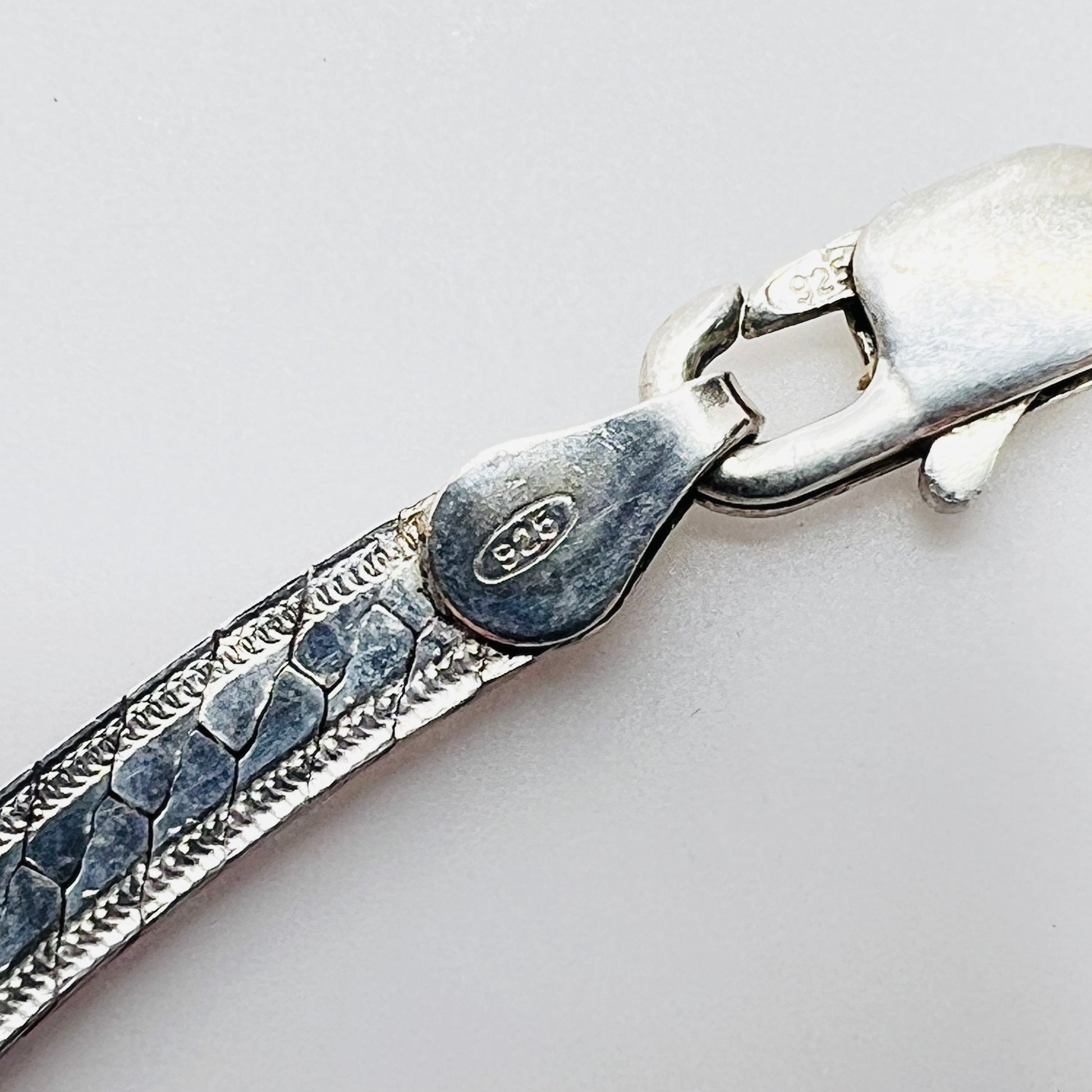 Close up of sterling 925 Italy clasp on vintage snake chain