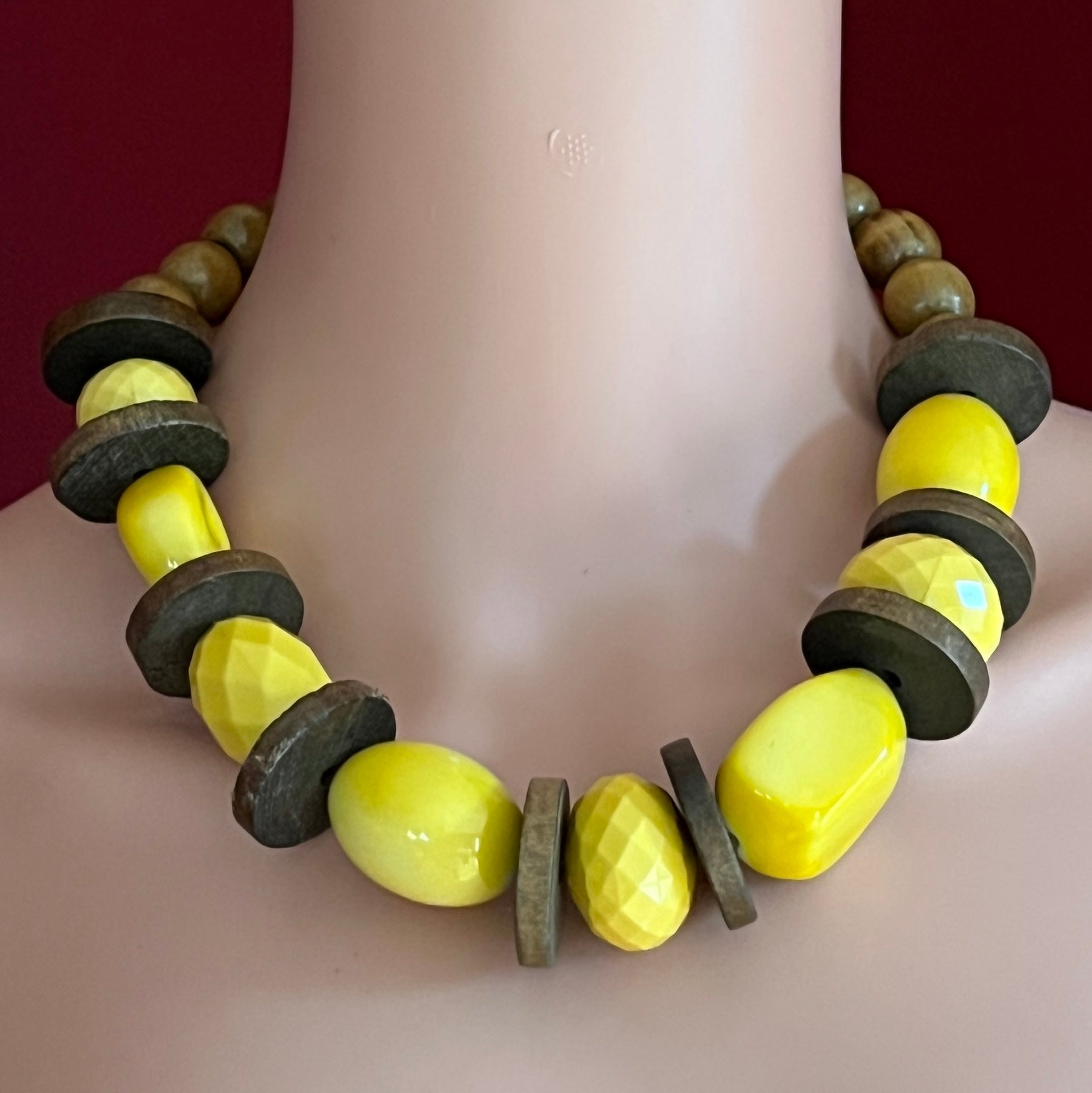 Yellow lucite and wood bead necklace with faceted and smooth beads