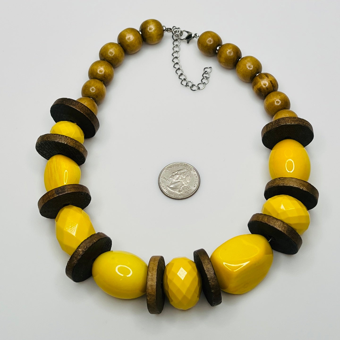 Detail of round wood neck beads and contrasting textures