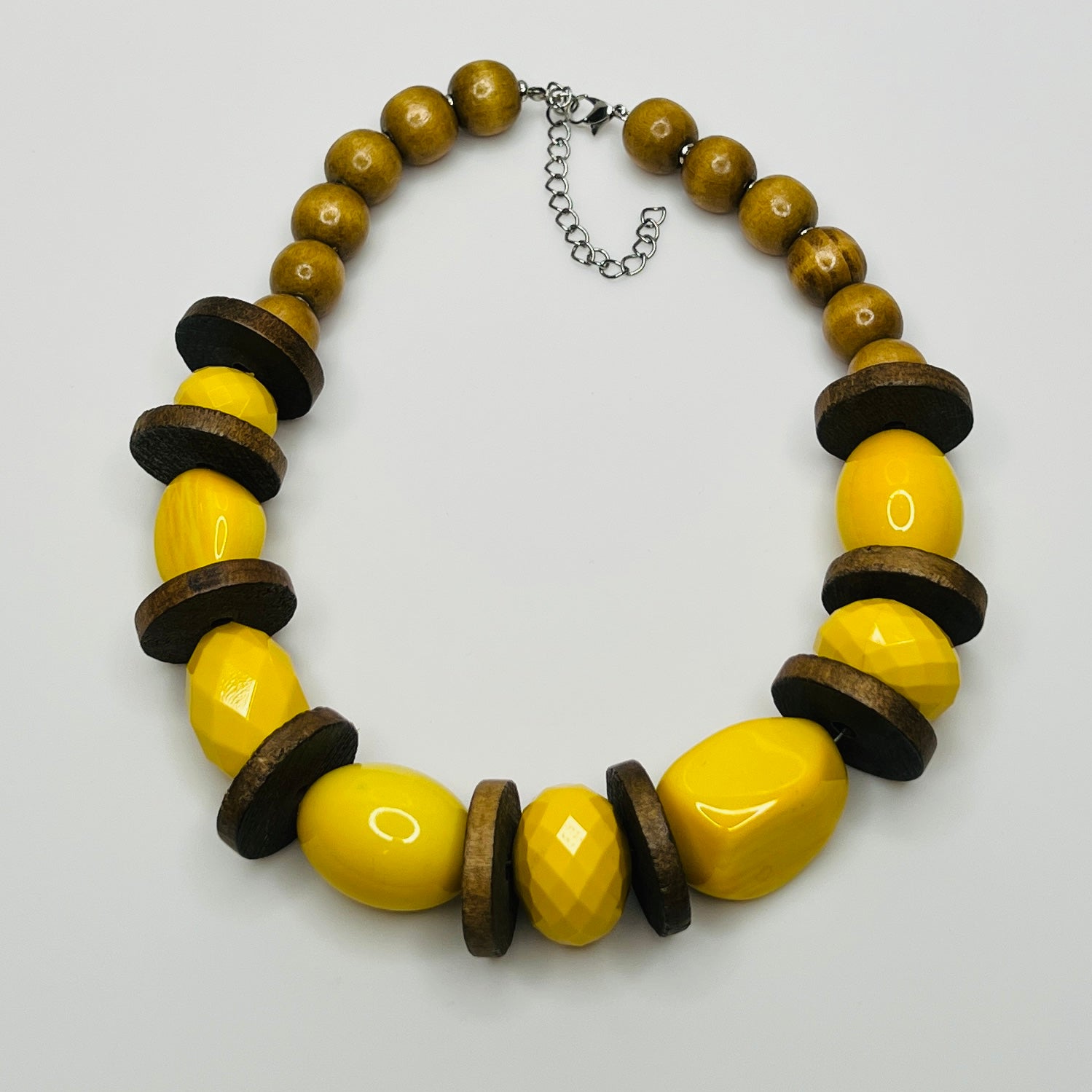 Yellow lucite and wood bead necklace with faceted and smooth beads