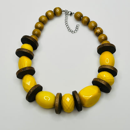 Yellow lucite and wood bead necklace with faceted and smooth beads