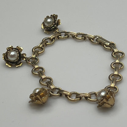 Mid-century gold-tone charm bracelet with faux pearl rosebuds